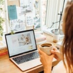 woman organizing photos on the computer with cup of coffee_chatgbt prompts for health