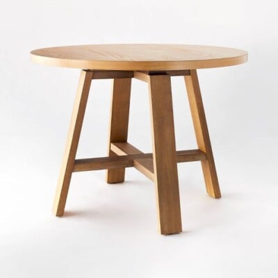 Linden round wood dining table.