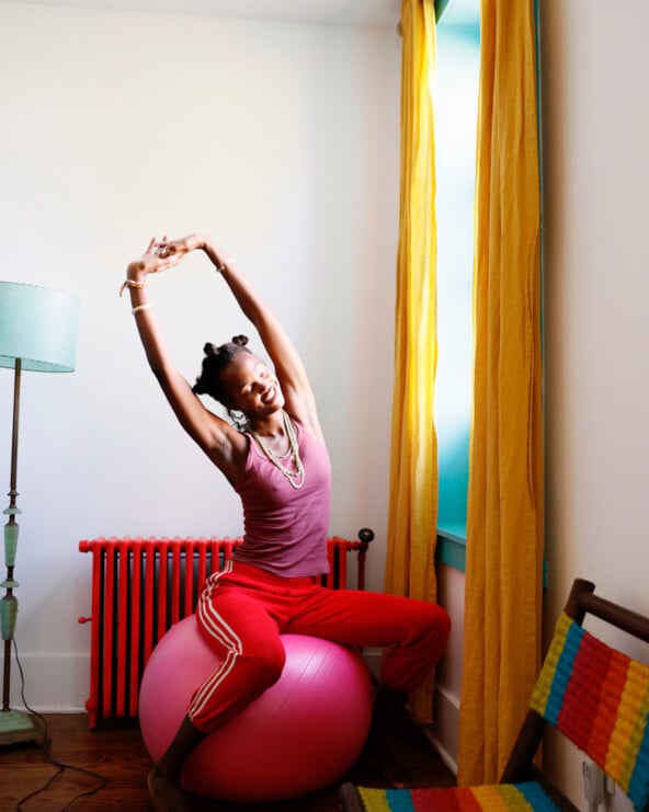 Woman stretching on exercise ball