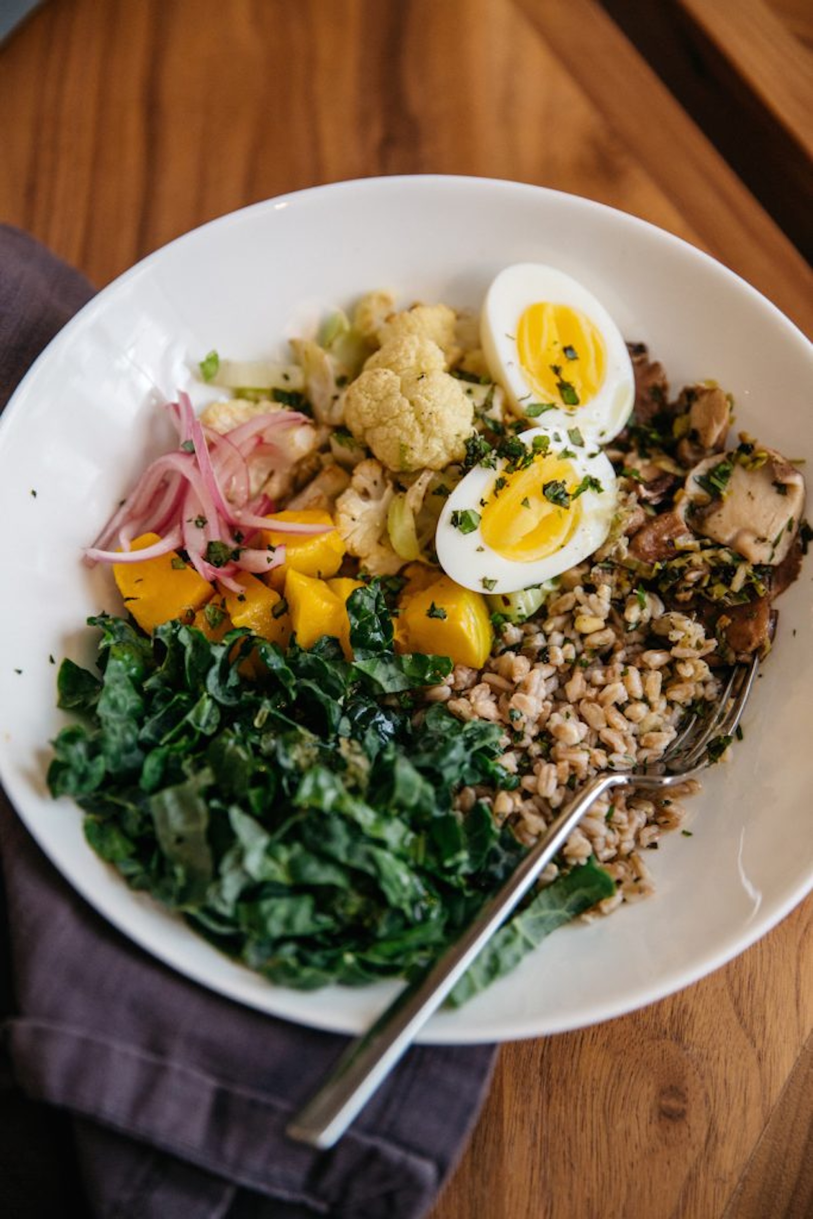 warm farro bowl with roasted cauliflower and kale