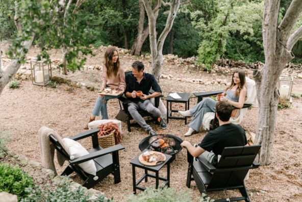 Friends laughing outside at game night.