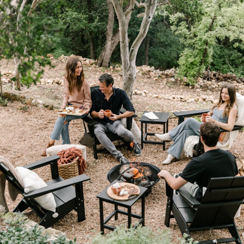 Friends laughing outside at game night.