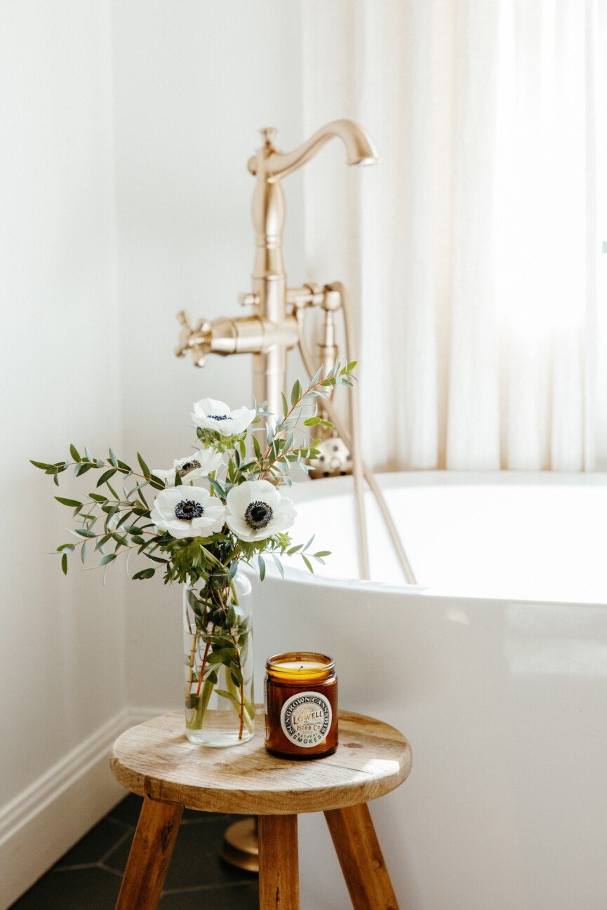 bathtub with flowers and candle