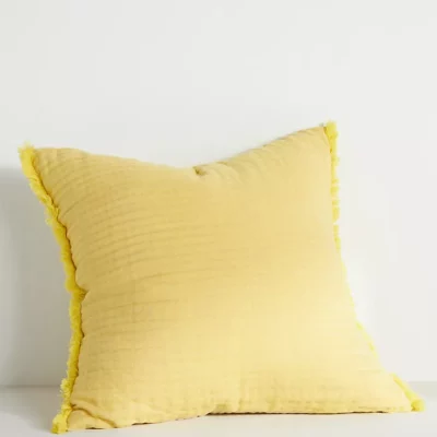 A yellow throw pillow