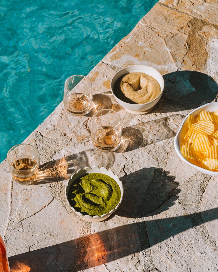 chips, wine, and dips by pool