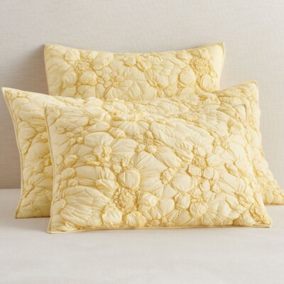 Quilted yellow shams with a floral design from Pottery Barn