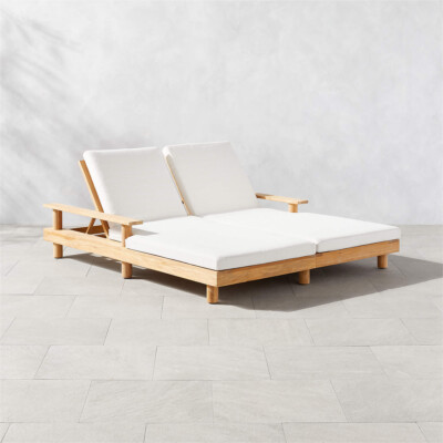 Pinet teak outdoor double chaise lounge with textured ivory cushions