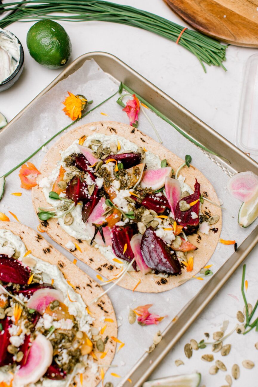 roasted beet tostadas with avocado cream, goat cheese, and pepitas