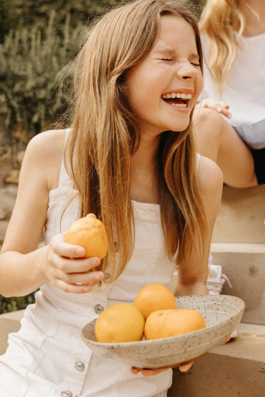 summer entertaining tips-kids laughing citrus