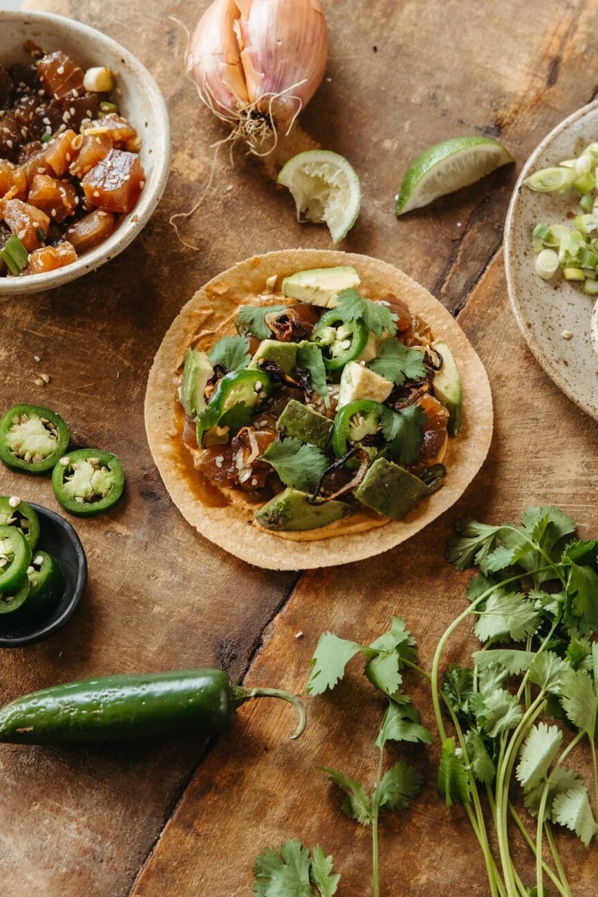 spicy tuna tostada with avocado and crispy shallots