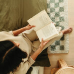 Woman reading book.