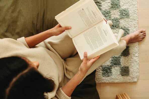 Woman reading book.