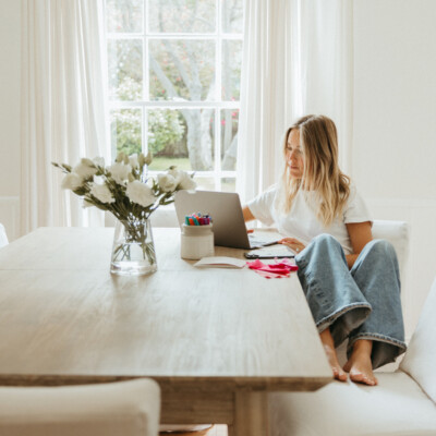 Blonde woman typing on computer_postpartum sex
