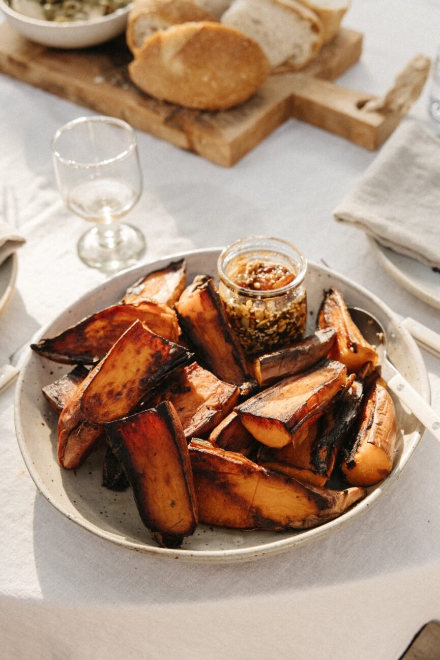 charred sweet potatoes with dates on plate