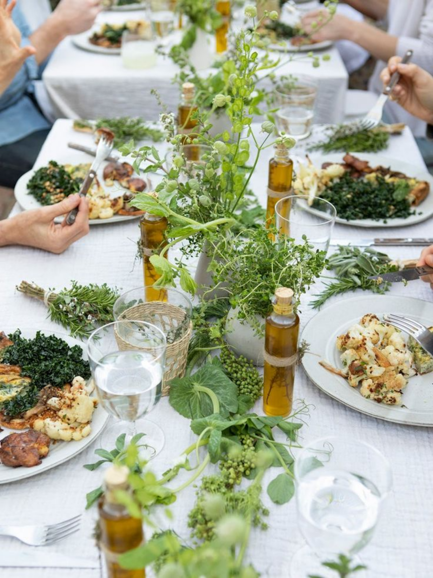 Summer table scene with greenery.