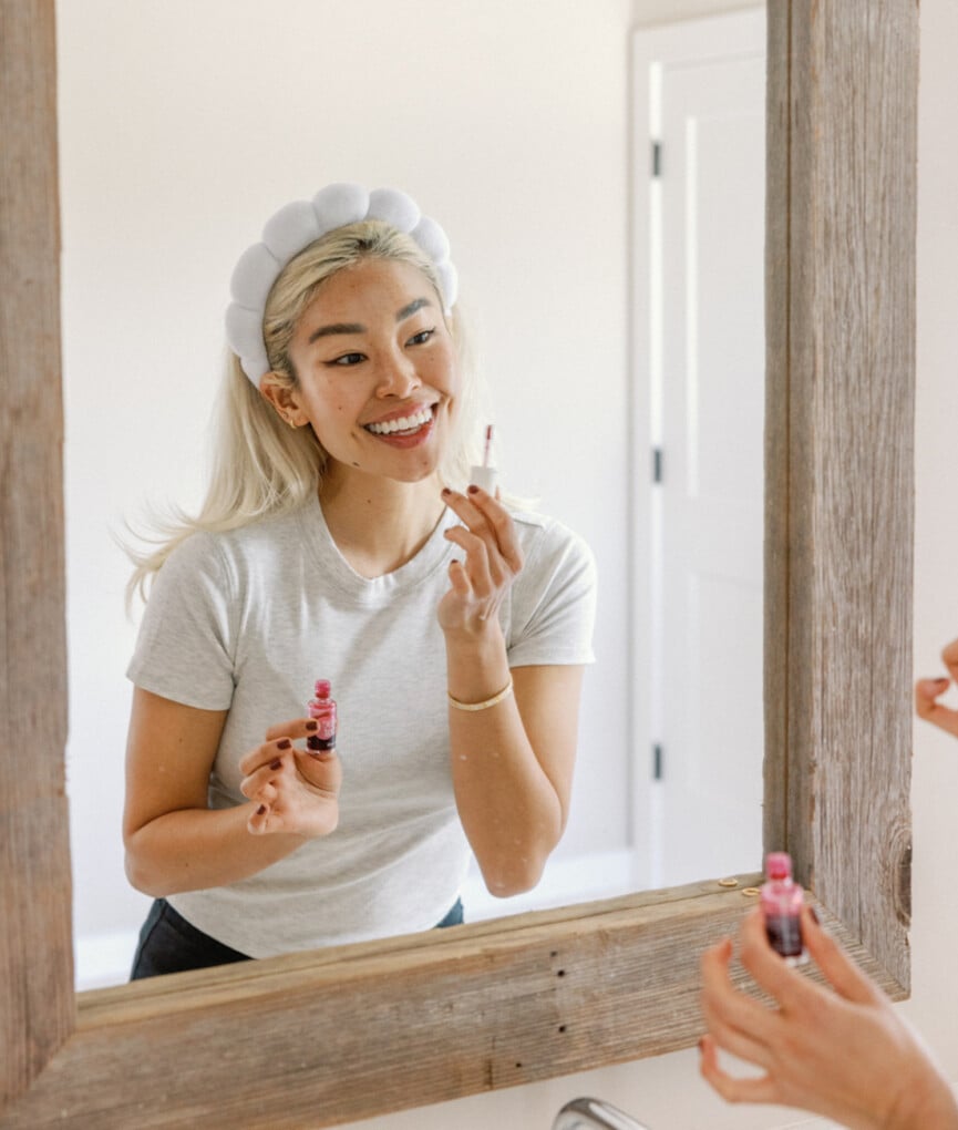 Woman applying beauty products_wellness practices