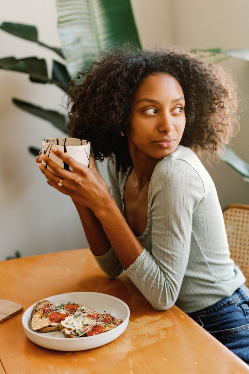 Woman drinks breakfast tea.