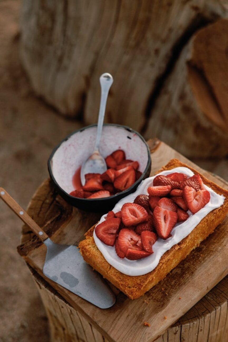 gluten-free citrus cake with strawberries and cardamom coconut cream