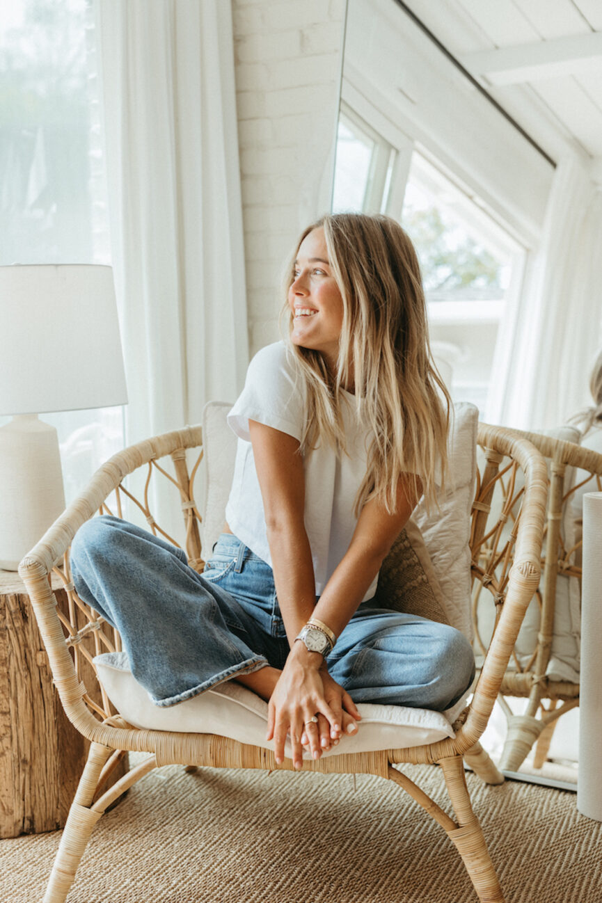 Mary Ralph Bradley smiling sitting in chair.