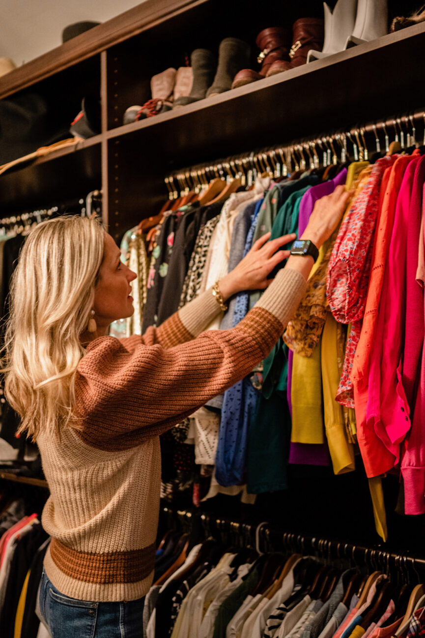 Woman rummaging in closet.