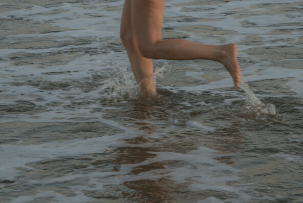 Woman running in water.