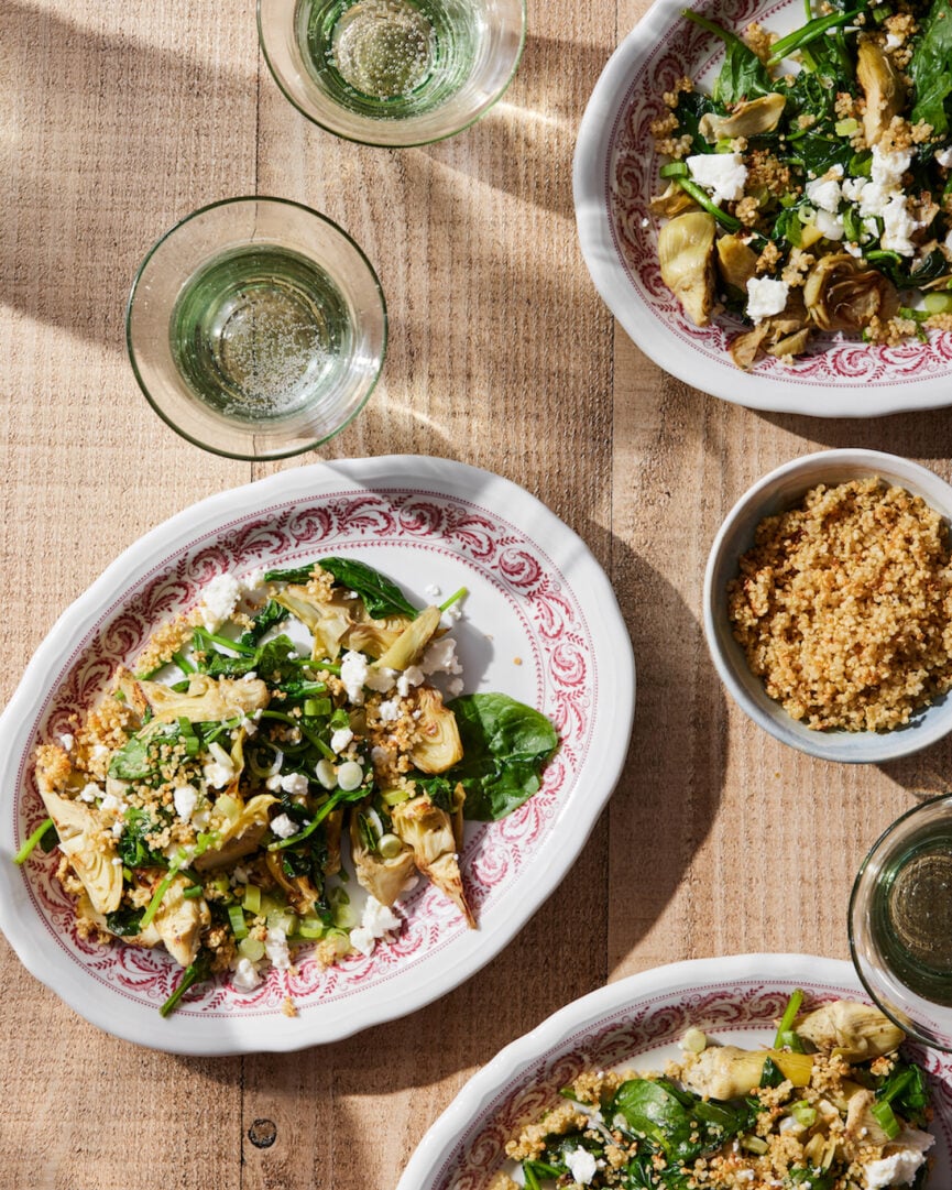 Warm Spinach Artichoke Salad with Quinoa Crisps