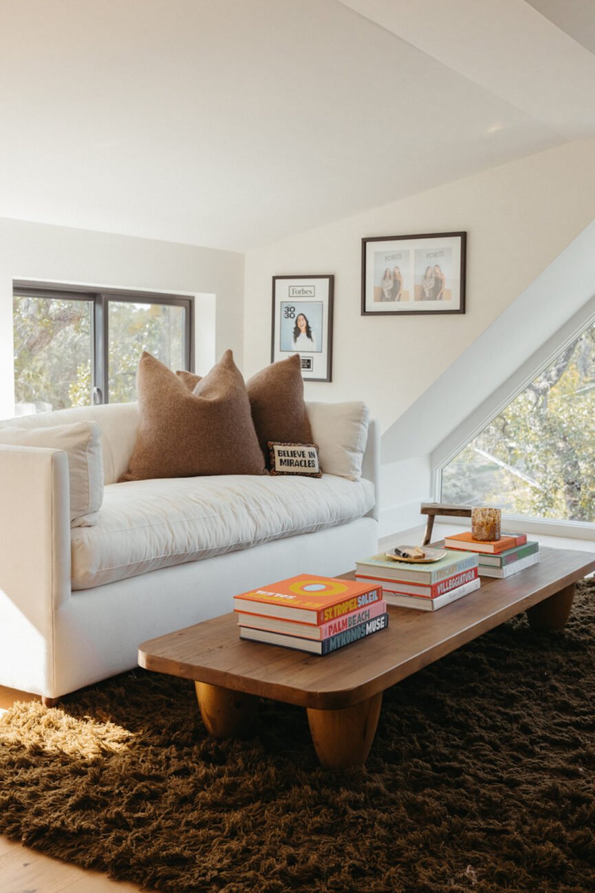 White couch and brown coffee table.