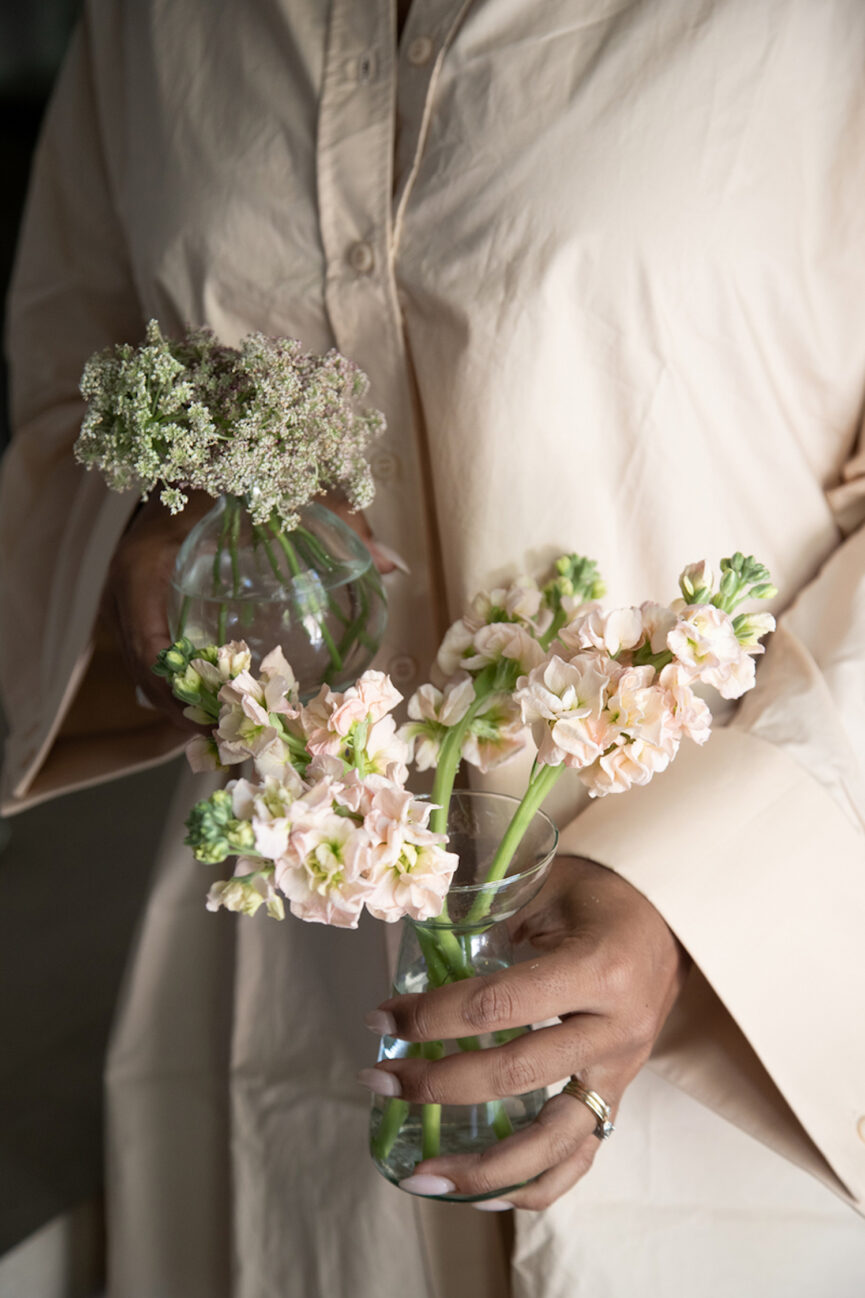 Holding flowers.