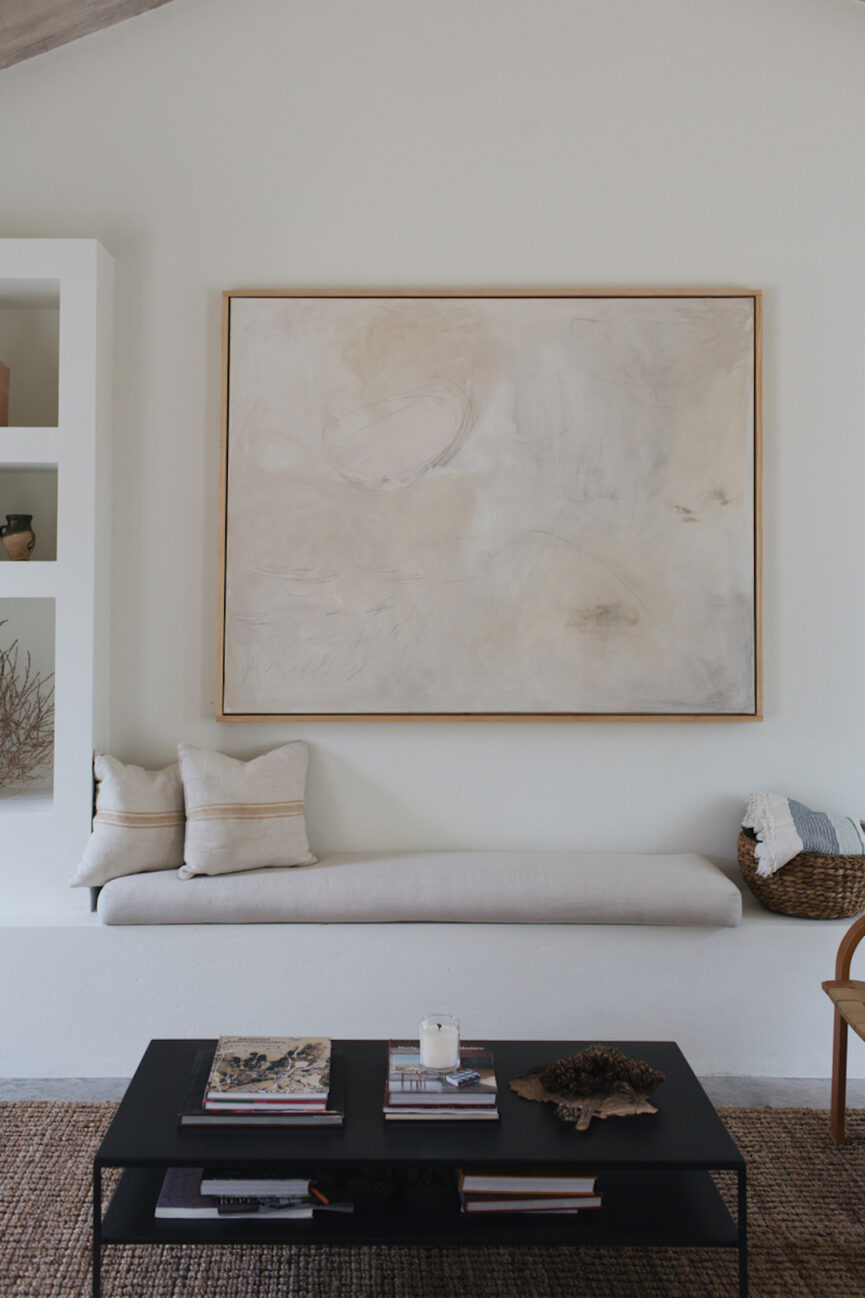 Narrow coffee table in a minimalist space.