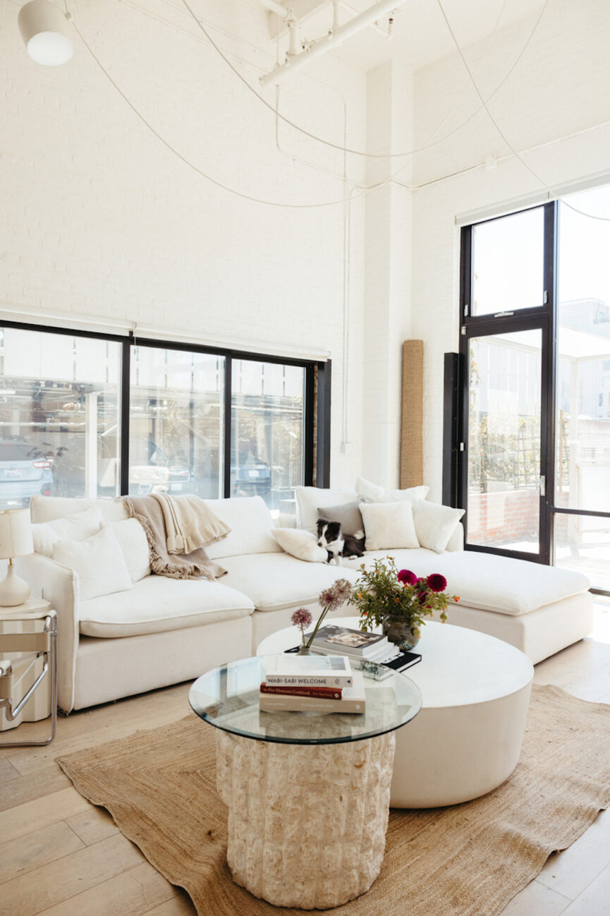 Neutral, minimalist living room with built-in coffee table.