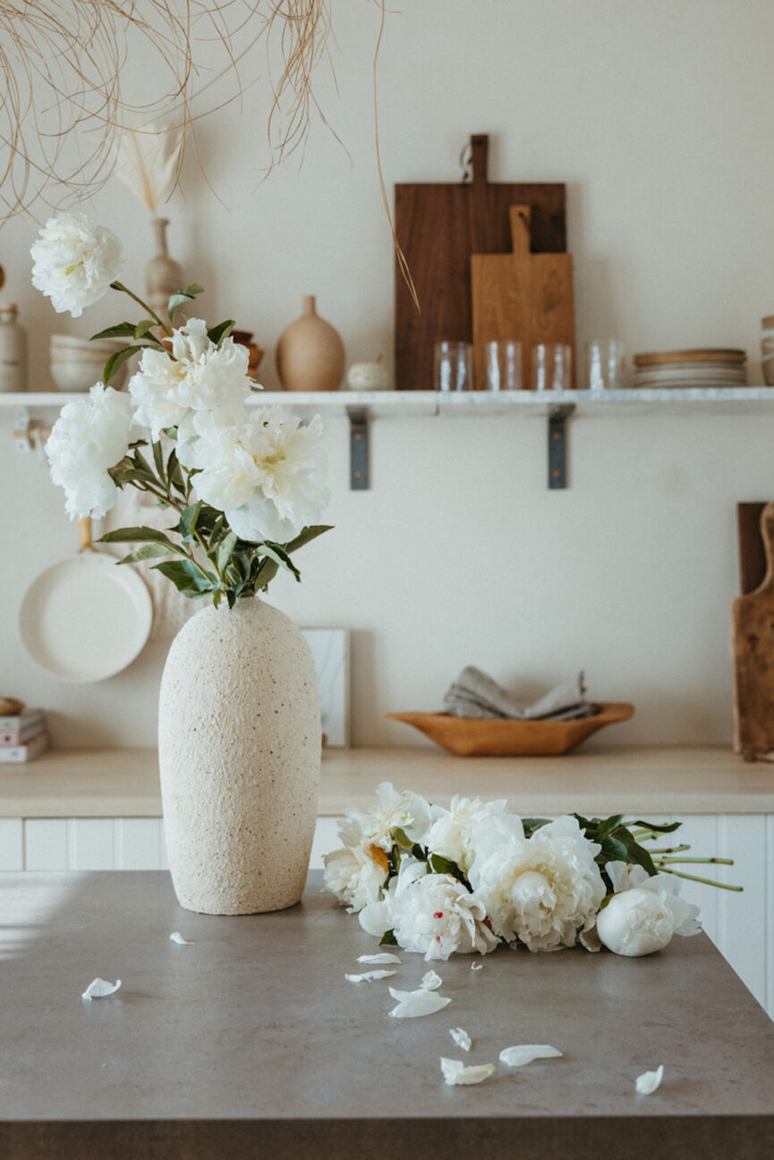 Peonies in vase flower arrangement.