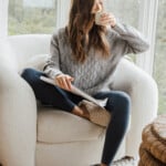 woman reading and drinking coffee