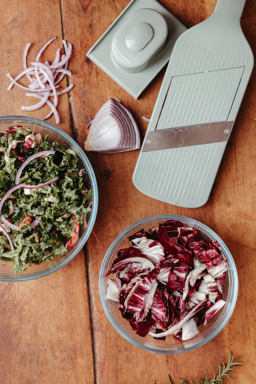 Salad ingredients cut on a mandoline.