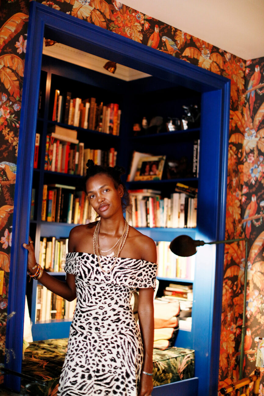 Woman wearing zebra print dress.