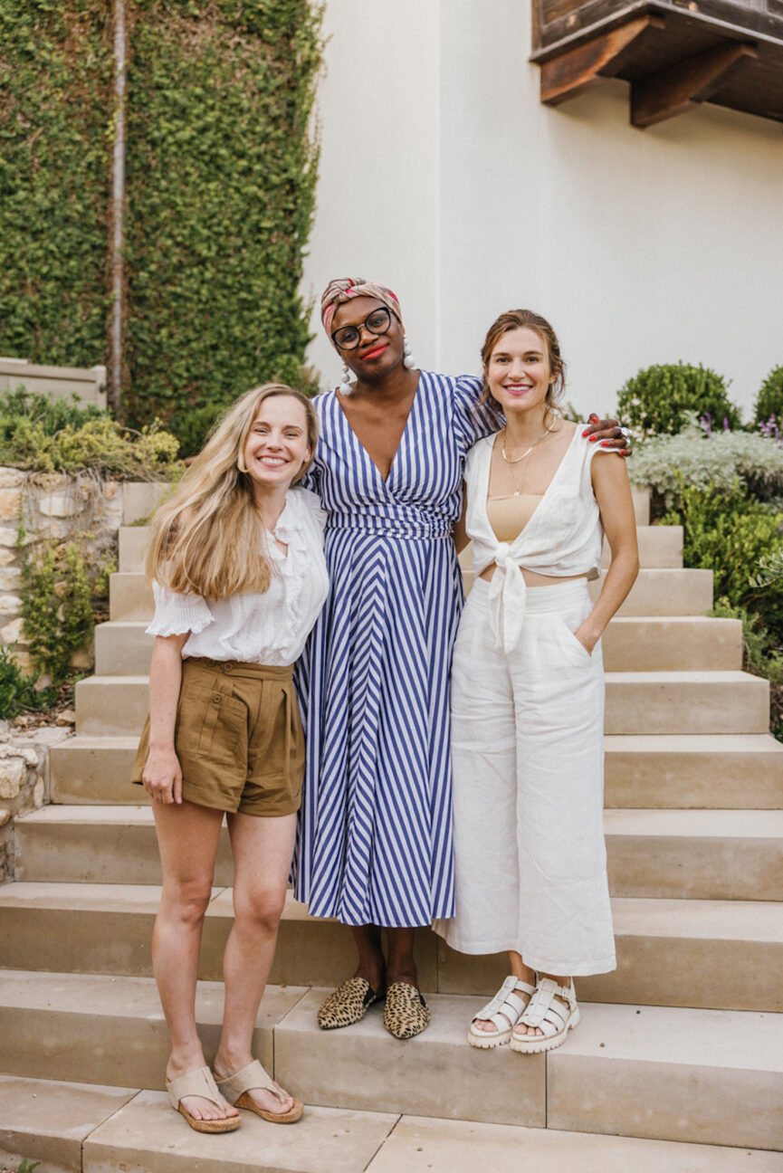 Three friends posed for photos outside.