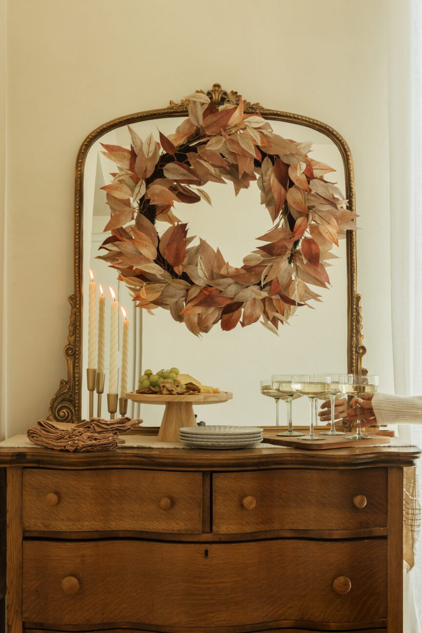 Fall evergreen wreath and buffet side table.