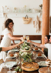 hostess gift ideas guests cheersing over table