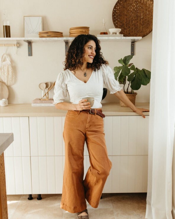 Woman drinking coffee in a coffee nook.