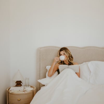 Woman drinking coffee in bed