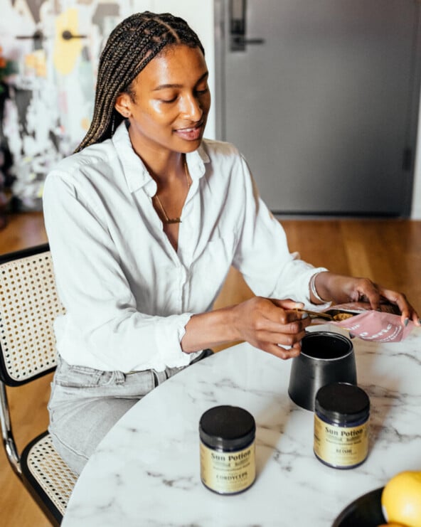 Woman portioning supplements.