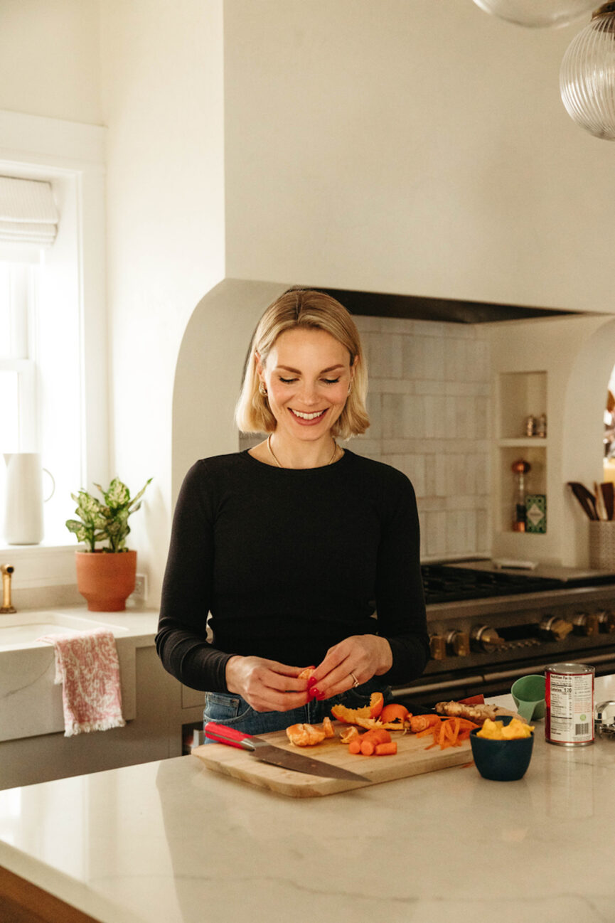 Woman preparing fruit in kitchen