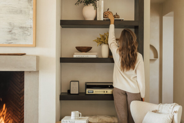 Woman styling fall shelf