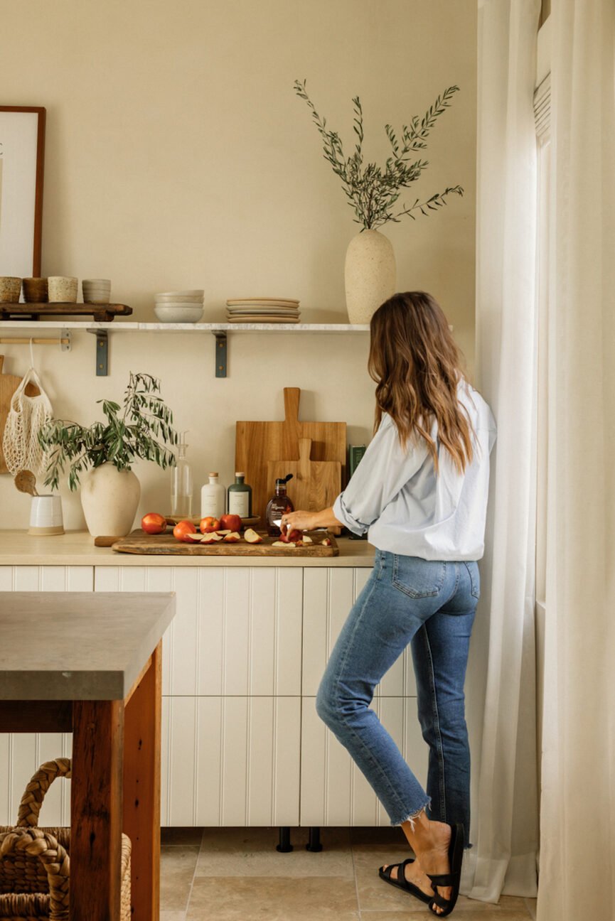 woman cooking in small kitchen