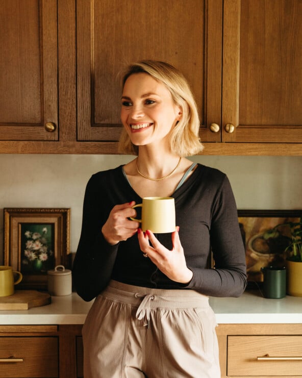 woman holding favorite things party mug