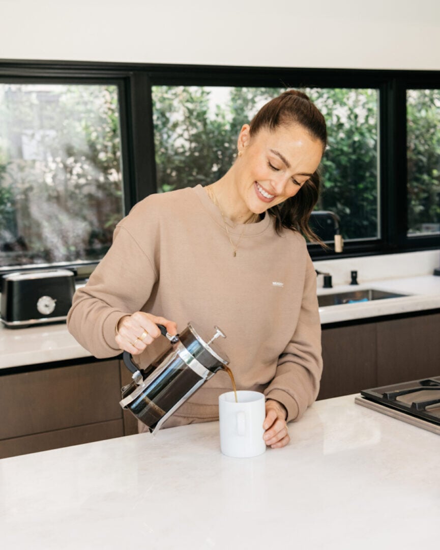 woman pouring coffee