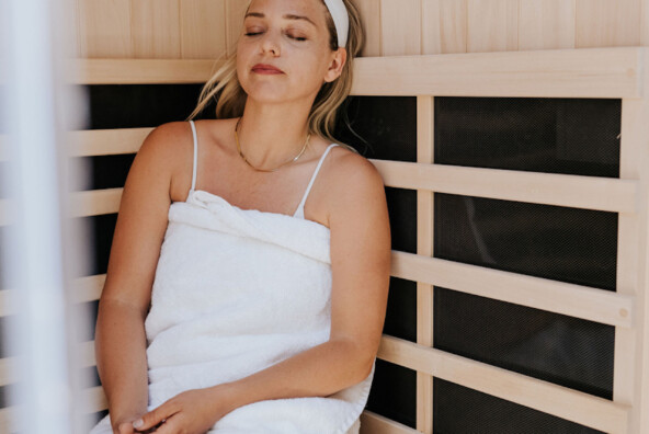 Woman sitting in sauna