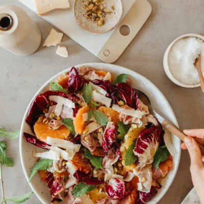 Raddichio citrus prosciutto salad on table