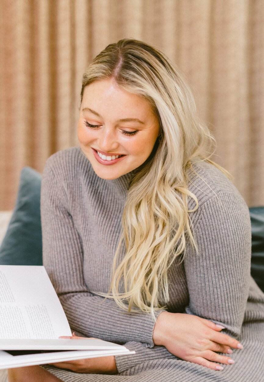 Iskra Lawrence reading one of the best goal-setting books