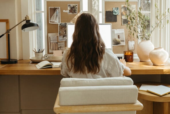 Woman writing at desk