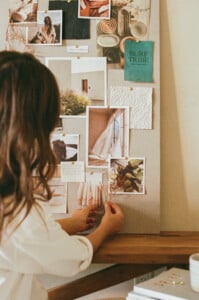camille styles with vision board